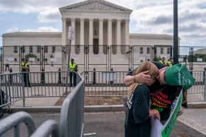 An abortion-rights activist comforts her daughter following the ruling in Washington.