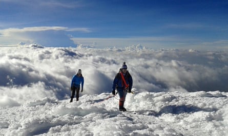 Juilo and Rakesh arrive at the summit of Cayembe