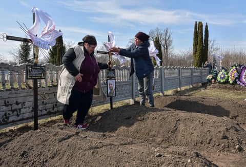 Yulia, the aunt of Bohdan Hladky, at the cemetery in Noviy Bykiv
