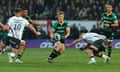 Fin Smith off-loads the ball during Northampton’s semi-final win over Saracens.