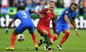 Cristiano Ronaldo is challenged by Payet.
