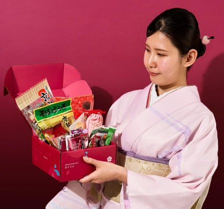 A personification holding a Sakuraco Kyoto Valentine’s Snack Box