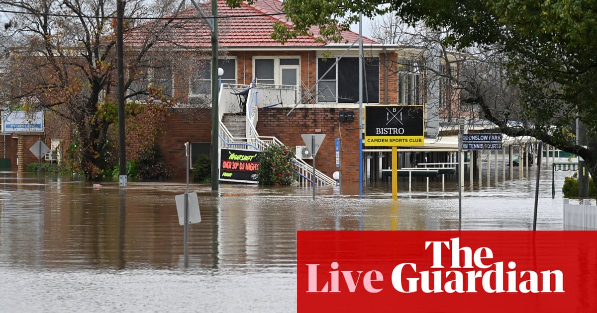 Australia news live: major flooding hits north-west Sydney; nation passes 10,000 Covid deaths