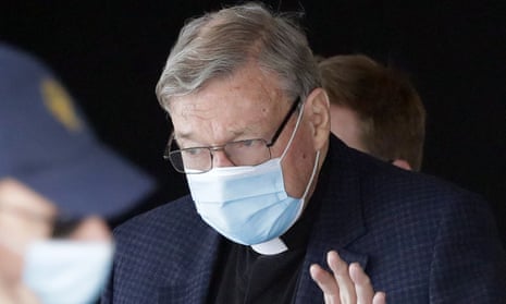 Cardinal George Pell waves as he arrives at Rome’s international airport in October