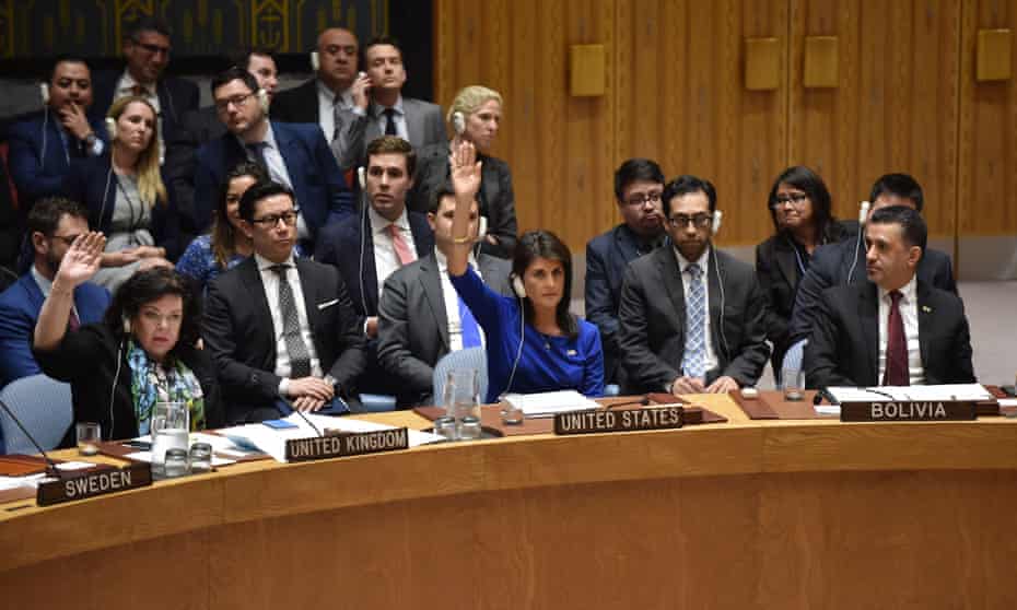 British ambassador to the UN Karen Pierce (L) and US ambassador to the UN Nikki Haley (C) vote during a UN security council meeting, at the United Nations Headquarters in New York, on 14 April.