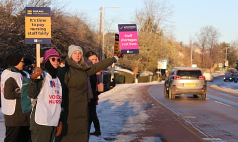 Nurses on the picket line outside Addenbrooke’s hospital in Cambridge. They are seen holding up placard to passing cars.