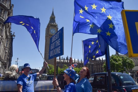 People wave flags outside Westminster.