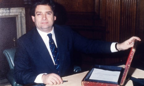 Nigel Lawson, with his battered red budget box, in his office at the Treasury in March 1987. 