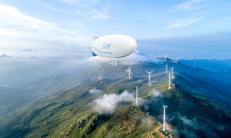 Artists impression of a Flying Whales airship over wind turbines on a mountain top