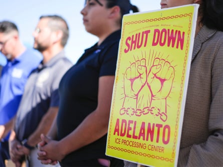 Woman holds up sign