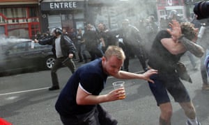 English fans run for cover after being pepper-sprayed by French police in Lille.