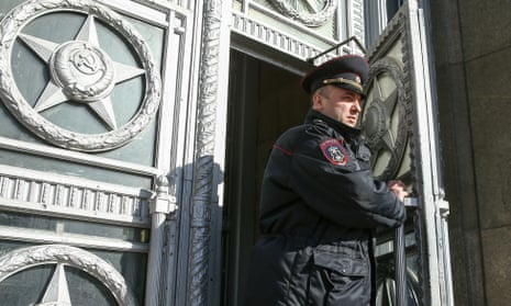A police officer outside the Russian foreign ministry where European ambassadors were summoned to be informed of the expulsions of diplomatic staff.