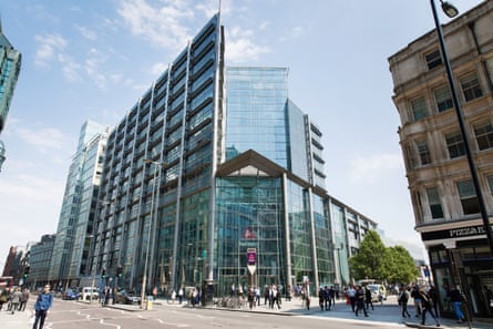 Tall glass office building on a corner site