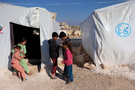 Children  at a displacement camp for earthquake survivors in the Syrian town of Darat Izza near Aleppo. 