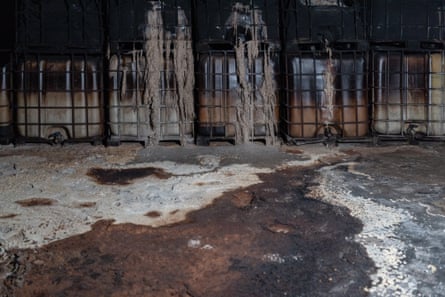 Containers with chemicals leaking out