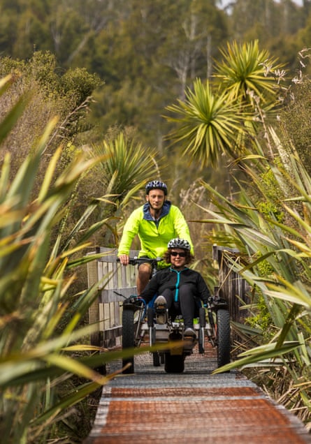 Natalie Gauld and Matt Rees-George cycling the boardwalk at Lake Mahinapua.