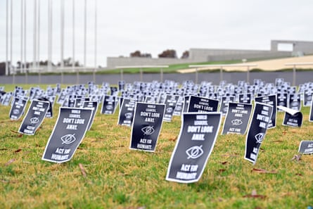 Banners in a field saying: ‘World leaders don’t look away. Act for humanity’