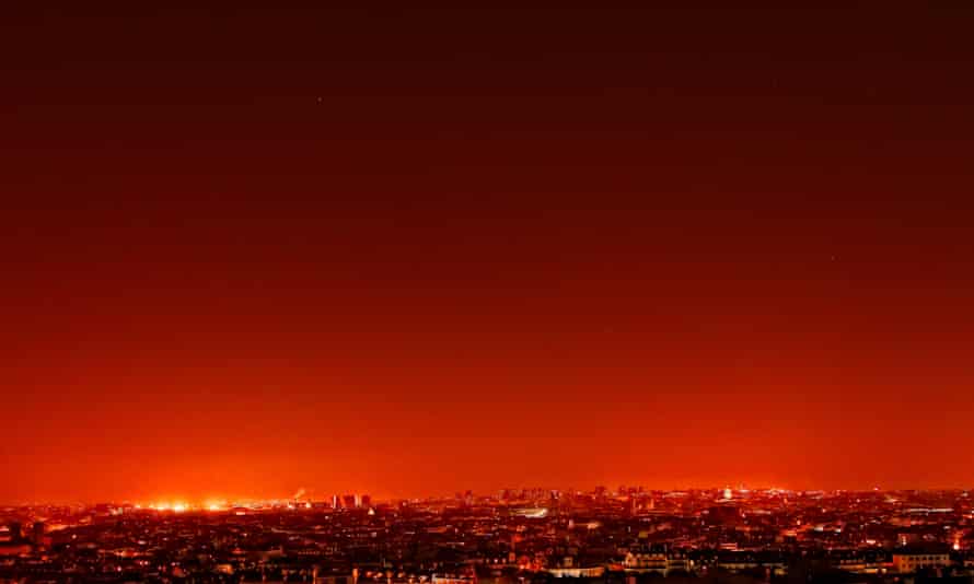 Blood red sky over a city