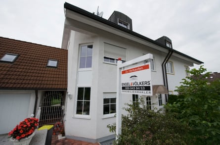 A for sale sign hangs outside a residential property in Unterschleißheim, near Munich, Germany, in 2010.