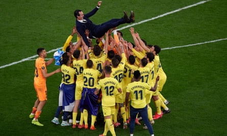 Villarreal’s players throw head coach Unai Emery (top) into the air after winning the Europa League final in 2021.