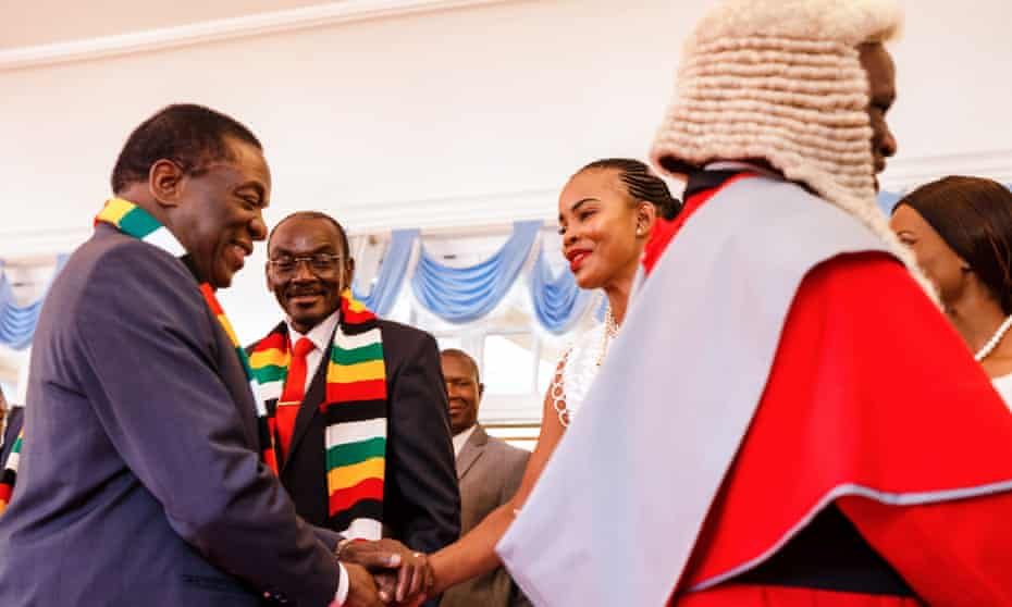 Mary Mubaiwa shakes hand with President Emmerson Mnangagwa in 2018.