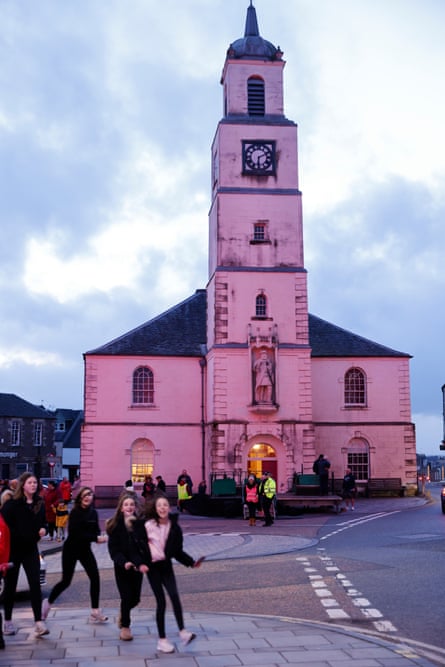 Children running around a church