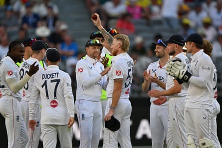 Ben Stokes holds the ball aloft after taking his fifth wicket in Perth