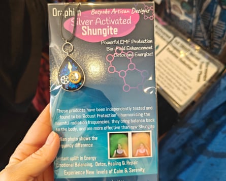 A person holding a packet of ‘silver activated shungite’