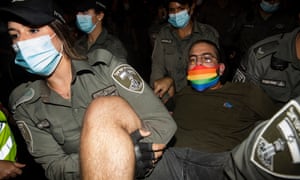 Police officers detain a protester during a demonstration against Israeli Prime Minister Benjamin Netanyahu on August 1, 2020 in Jerusalem, Israel.