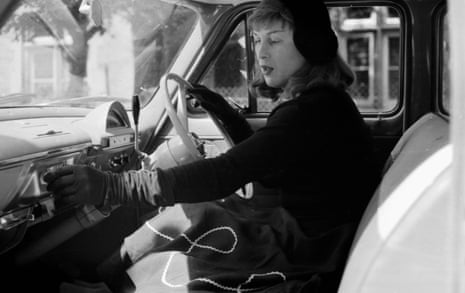 Roberta Cowell in her car, 1958. Cowell, a former racing driver and RAF pilot, was the first person to undergo gender reassignment surgery in the UK.