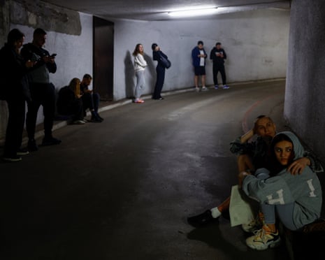 Residents gather in an underground parking lot during the strikes