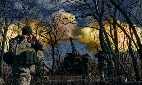 Ukrainian soldiers fire a self-propelled howitzer towards Russian positions near Bakhmut.