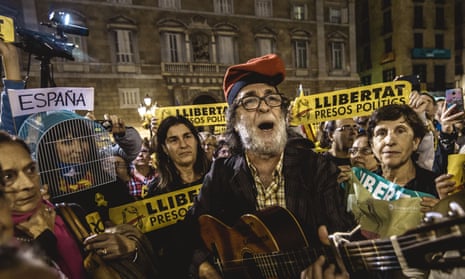 Catalan separatists with their placards demanding ‘freedom for the political prisoners’ sing folk songs as they demand the release of eight members of the former Catalan government who were remanded in custody for their part in the illegal independence referendum. 