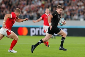 Beauden Barrett of New Zealand runs in to score their second try.