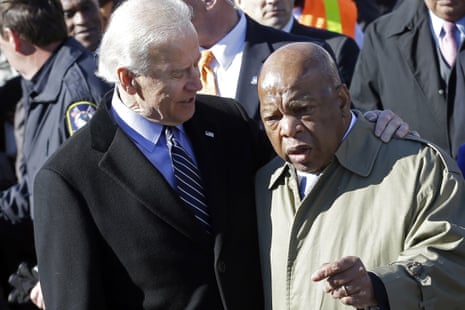 Joe Biden and John Lewis  as they prepare to lead a group across the Edmund Pettus Bridge in Selma, Alabama in 2013