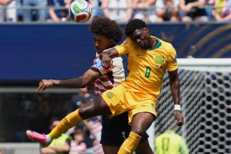 Chris Richards and Australia’s Mohamed Toure conteat a header.