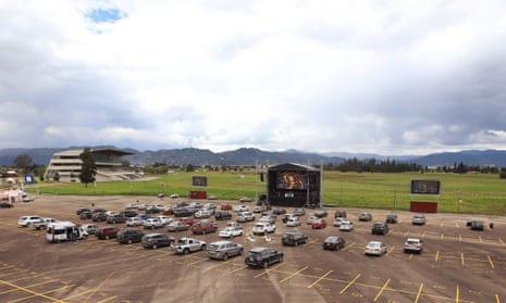Aerial picture showing Catholic devotees in their cars attending the drive-in in a parking lot in Bogota, Colombia.