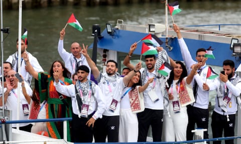 Team Palestine parade along the River Seine during the opening ceremony of the Olympic Games.