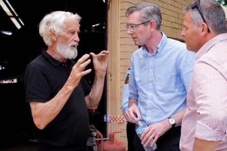 NSW premier Dominic Perrottet talks to the owner of Parallel Motors Greg Agustin