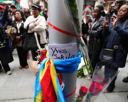 People attend a vigil for Yves Sakila on Henry Street, Dublin