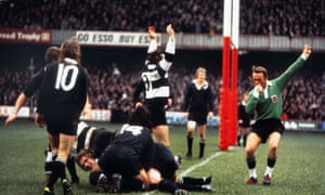 Fergus Slattery of the Barbarians touches down for the second try of the game despite the efforts of Bryan Williams.