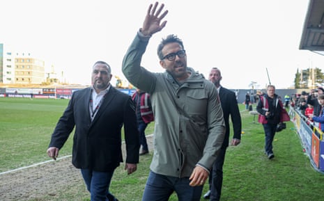 Ryan Reynolds waves to the home fans before kick off