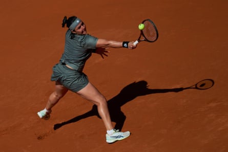 Ons Jabeur plays a backhand against Jelena Ostapenko during her win in Madrid on Monday.