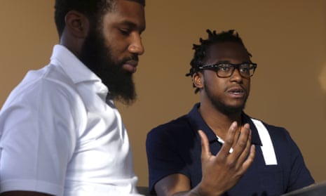Rashon Nelson, left, listens as and Donte Robinson, right, addresses a reporter’s question during an interview with the Associated Press in Philadelphia.