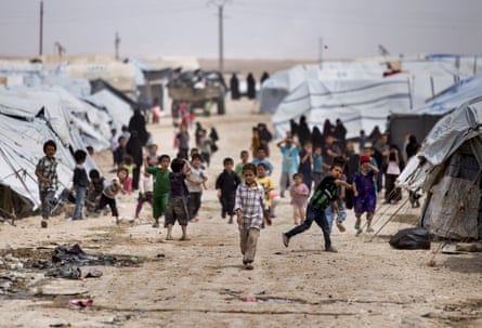 Children gather outside their tents in al-Hol camp