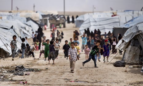 Children gather outside their tents at al-Hawl camp in Hasakeh province, Syria.