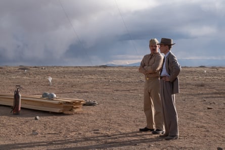 Cillian Murphy as the ‘father of the atomic bomb’ in the film Oppenheimer stands in the desert with Matt Damon as the military director of the project