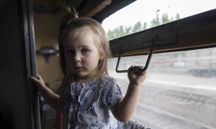 Internally displaced Kira from Toretsk stands inside a train heading to Dnipro, at the Pokrovsk train station, Donetsk region, eastern Ukraine.