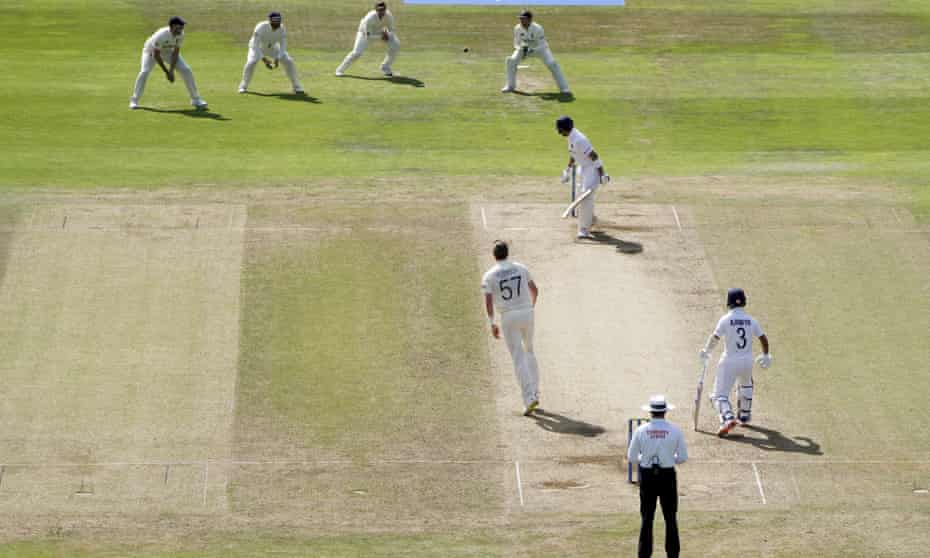 England captain Joe Root, third left, prepares to take the catch to dismiss India’s captain Virat Kohli, from the bowling of Ollie Robinson.