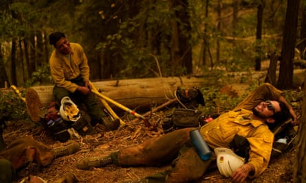Firefighters rest after a night battling the Creek fire in Fresno and Madera counties, California, last year.